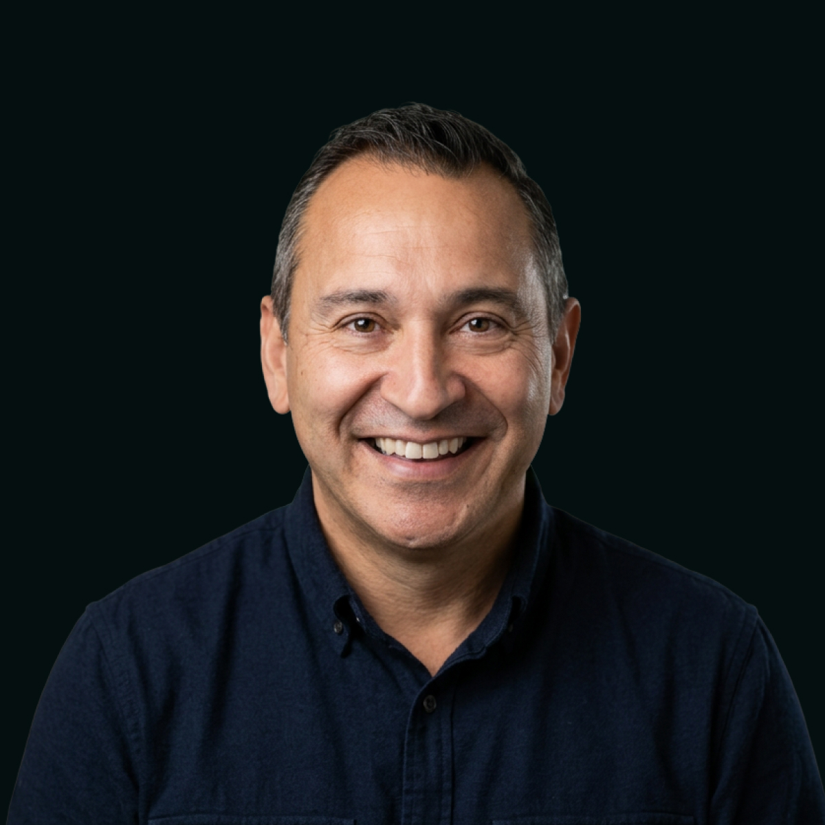 Headshot of Erwin Olguin against black background.