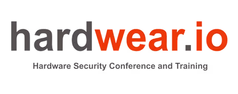 Logo showing the text 'hardware.io' with 'hard' in gray and 'wear.io' in red, below it the tagline 'Hardware Security Conference and Training' in gray.