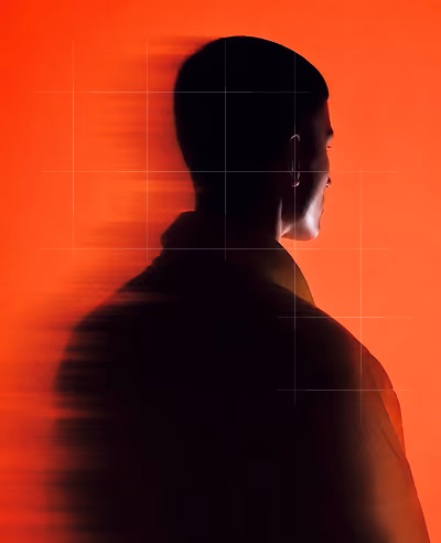 Silhouette of a man's profile facing right against a vibrant orange background with a blurred, shadow-like effect extending from the left side of his head and shoulders.