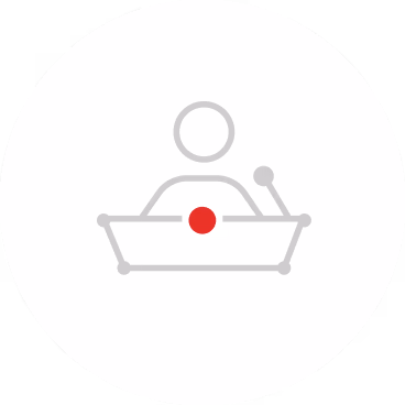 Icon of a person standing behind a podium with a microphone and a red dot on the podium front.