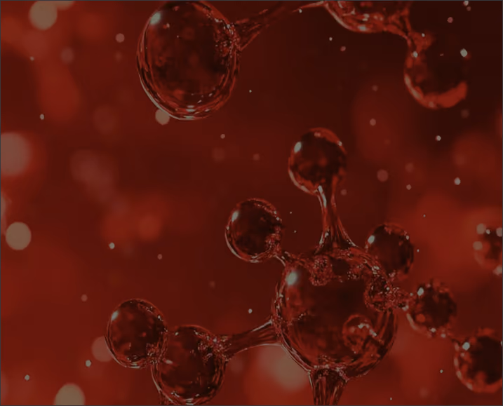 Close-up of red translucent molecular structures with spherical nodes connected by short links against a dark red backdrop.