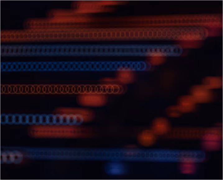 Abstract blurred horizontal lines and shapes in red and blue hues on a dark background.