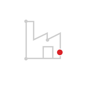 Simple gray line icon of a factory building with a red dot on the right side, on a white circular background.