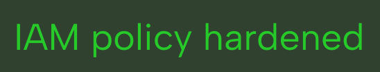 Text in green letters on a dark background reading: IAM policy hardened.