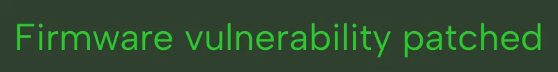 Green text on a black background reading 'Firmware vulnerability patched'.