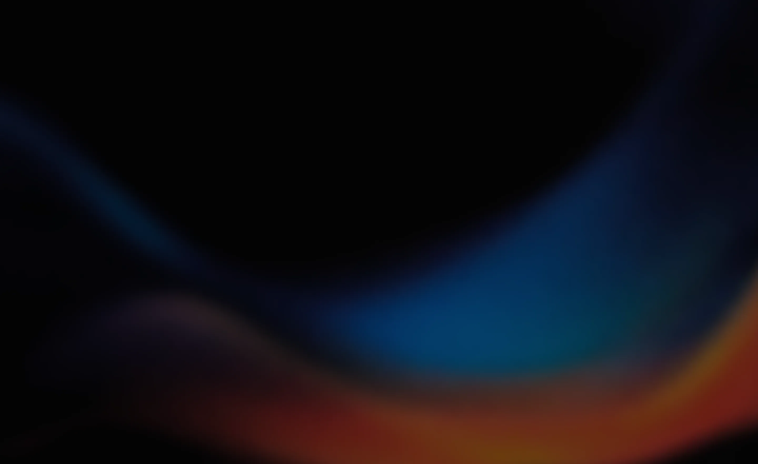 Abstract blurred background with dark tones and smooth gradient waves of blue, purple, and orange hues.