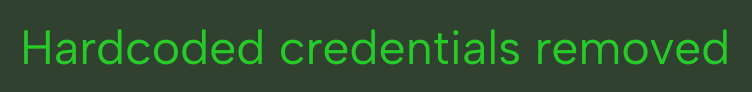 Text in bright green on a dark background reading: Hardcoded credentials removed.