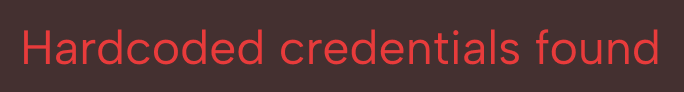 Red text on a dark background stating 'Hardcoded credentials found.'
