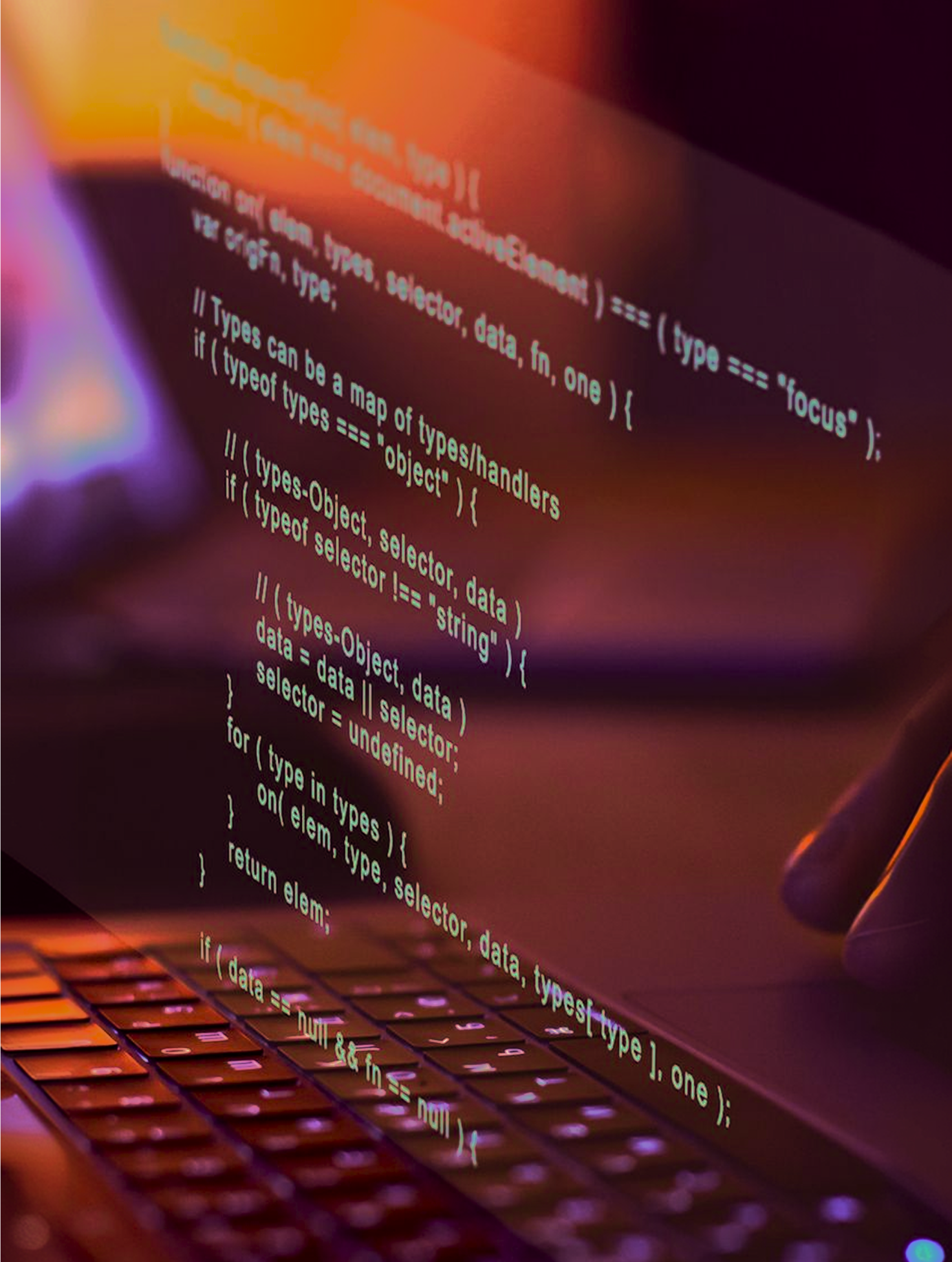 Close-up of a laptop keyboard with code reflected on the screen, showing programming text with a hand nearby, illuminated by warm orange and purple lighting.