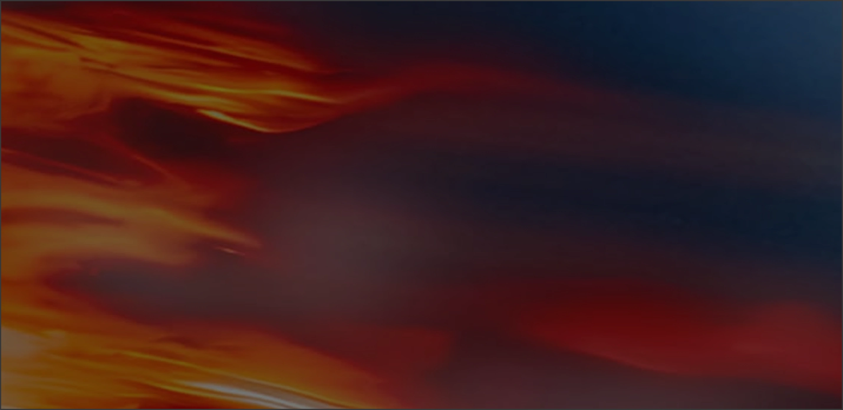 Abstract background with flowing, blurred streaks of orange, red, and dark blue colors blending smoothly.