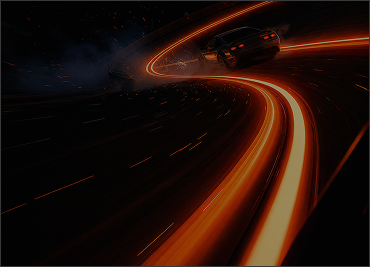 Black car drifting on a dark road at night, with bright orange light trails curving along the road.