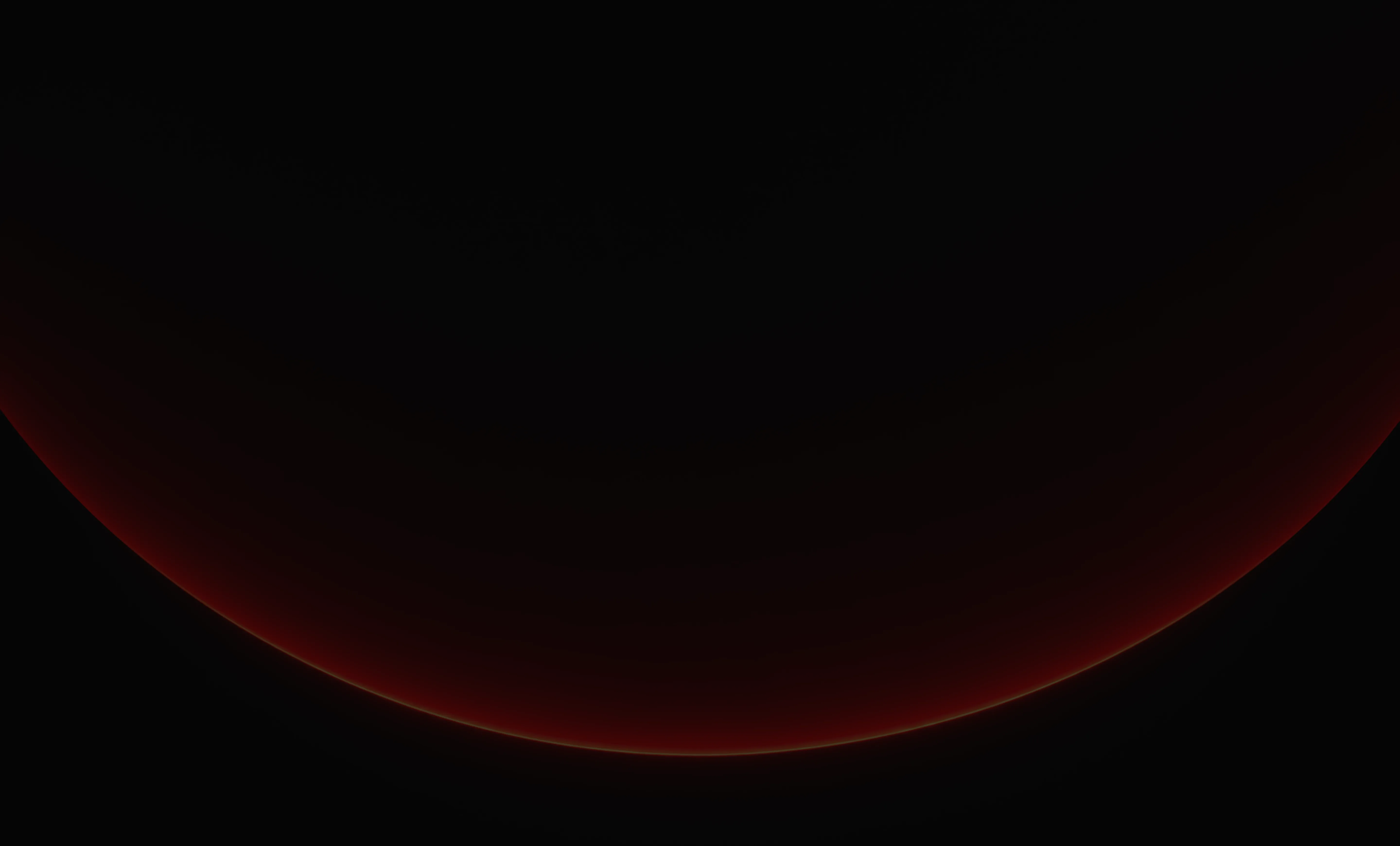 A dark curved shape with a faint red glow along its edge on a black background.