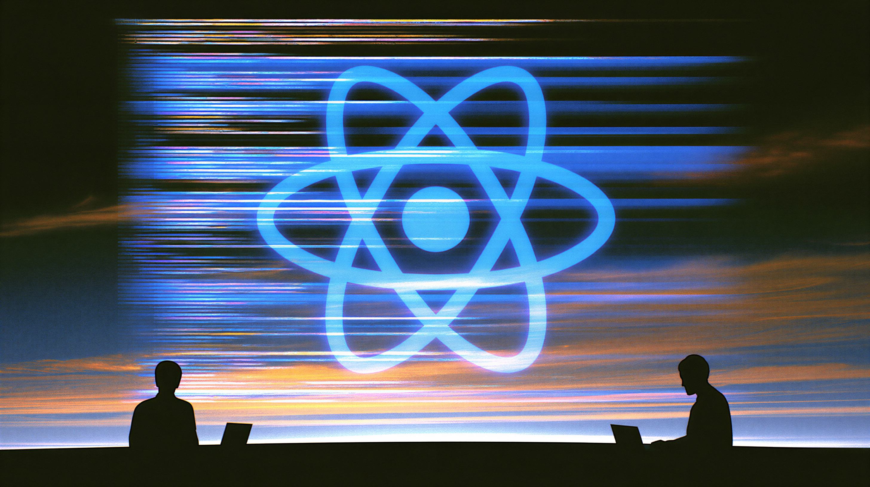 Silhouettes of two people sitting with laptops in front of a large glowing blue atomic symbol against a backdrop of a colorful sky with horizontal streaks of blue and orange light.