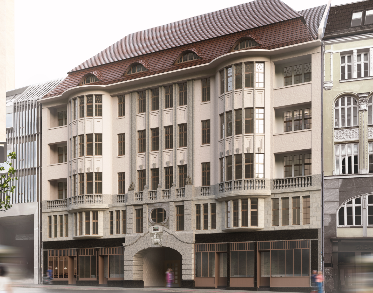 Historisches mehrstöckiges Gebäude mit rosafarbenen Wänden, zahlreichen rechteckigen Fenstern, zwei markanten Erkern und einem geschwungenen Dach mit dachartigen Gauben, an einer belebten Straße mit verschwommenen Fußgängern und benachbarten Gebäuden.