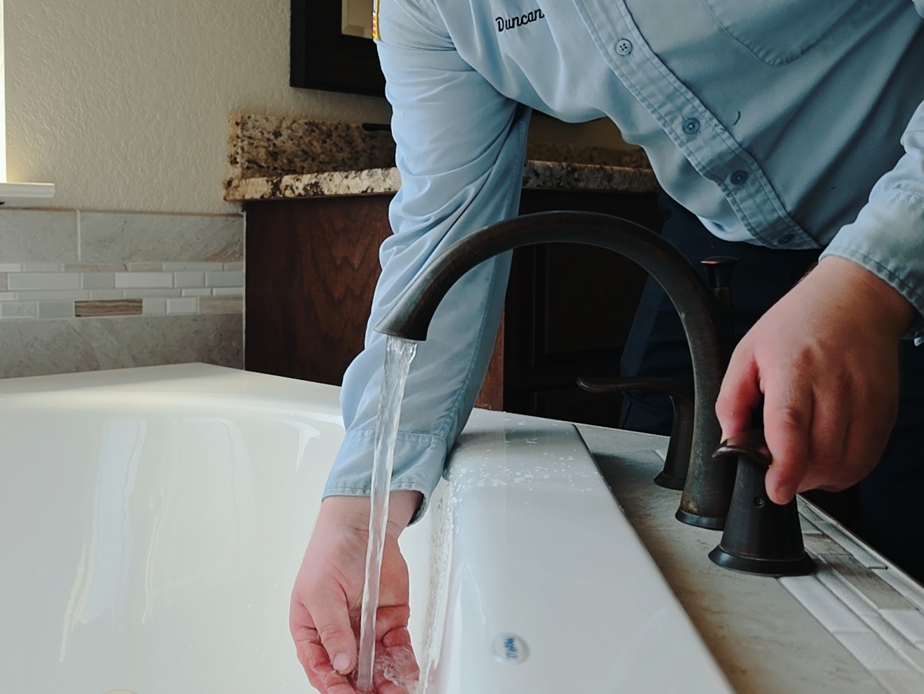 Patriot Plumbing technician completing residential plumbing work