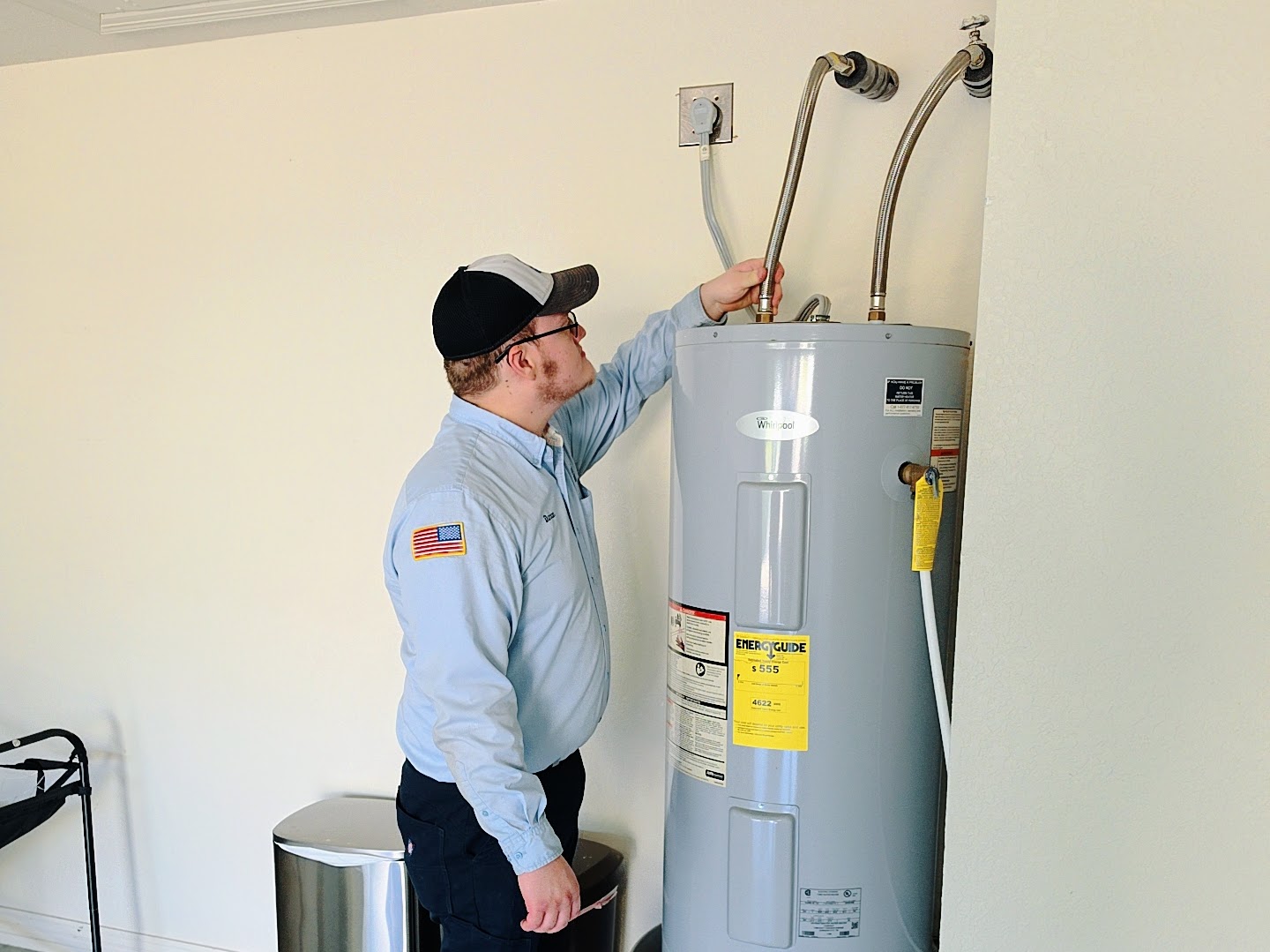 Patriot Plumbing technician inspecting a water heater