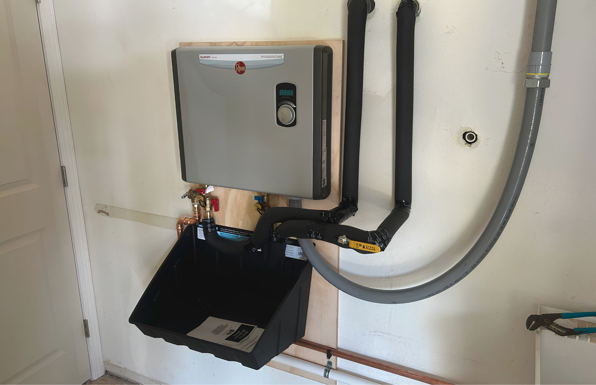 Electric tankless water heater installed by Patriot Plumbing