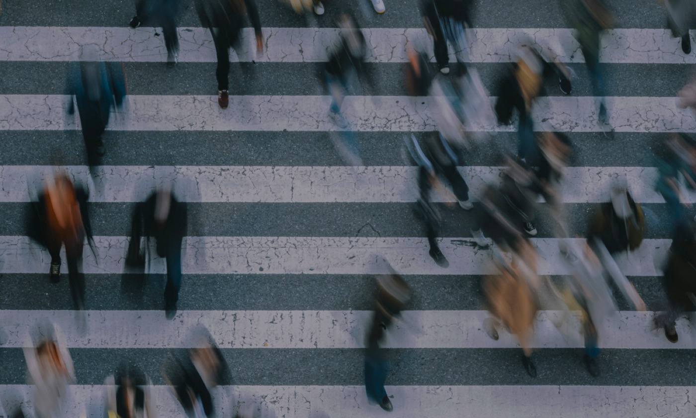 A shadowy photo of people walking.