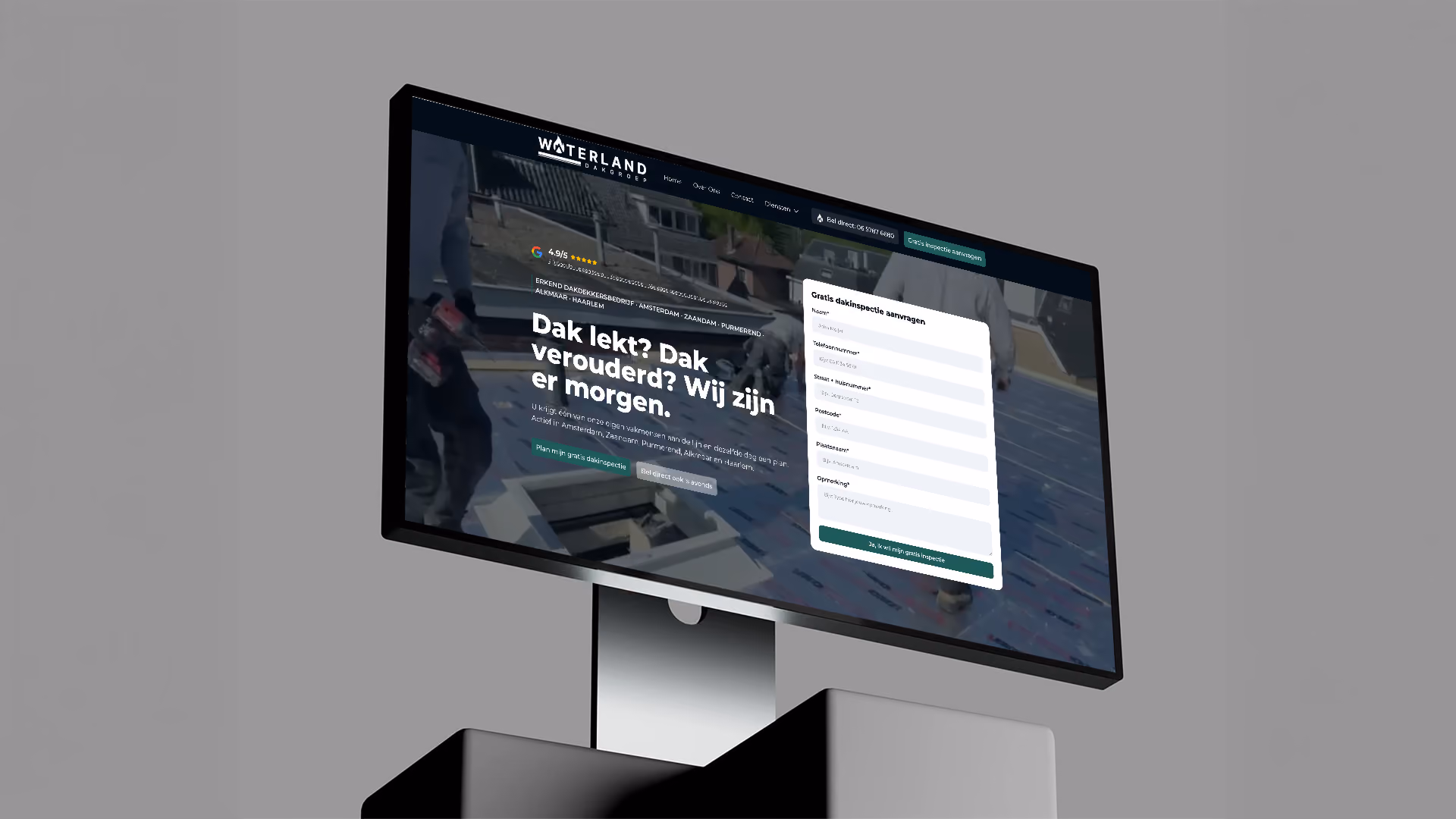 Waterland Dakgroep website shown on a monitor, with a Dutch roofing headline and a free roof-inspection request form