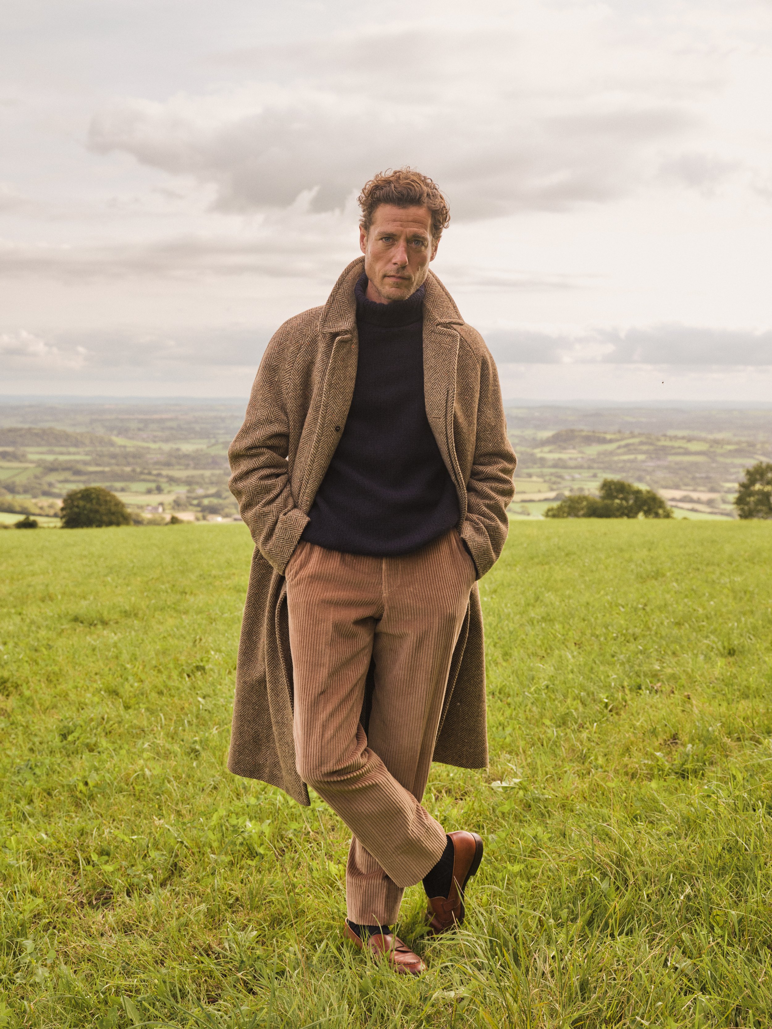 Three brown bags of Union coffee blends on a marble surface beside a dark blue box with gold text.