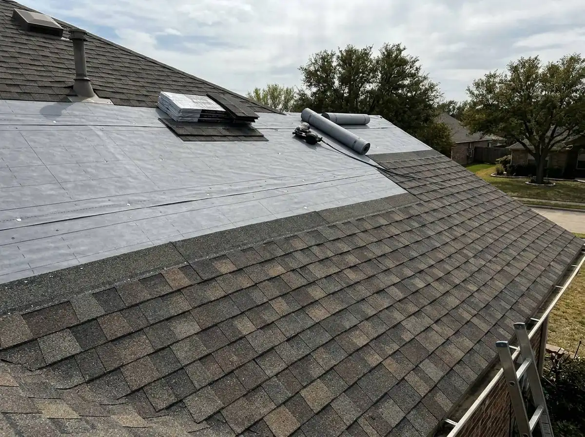 Roof mid-installation with synthetic underlayment