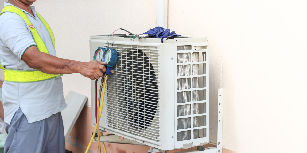 HVAC technician performing a seasonal air conditioning tune-up