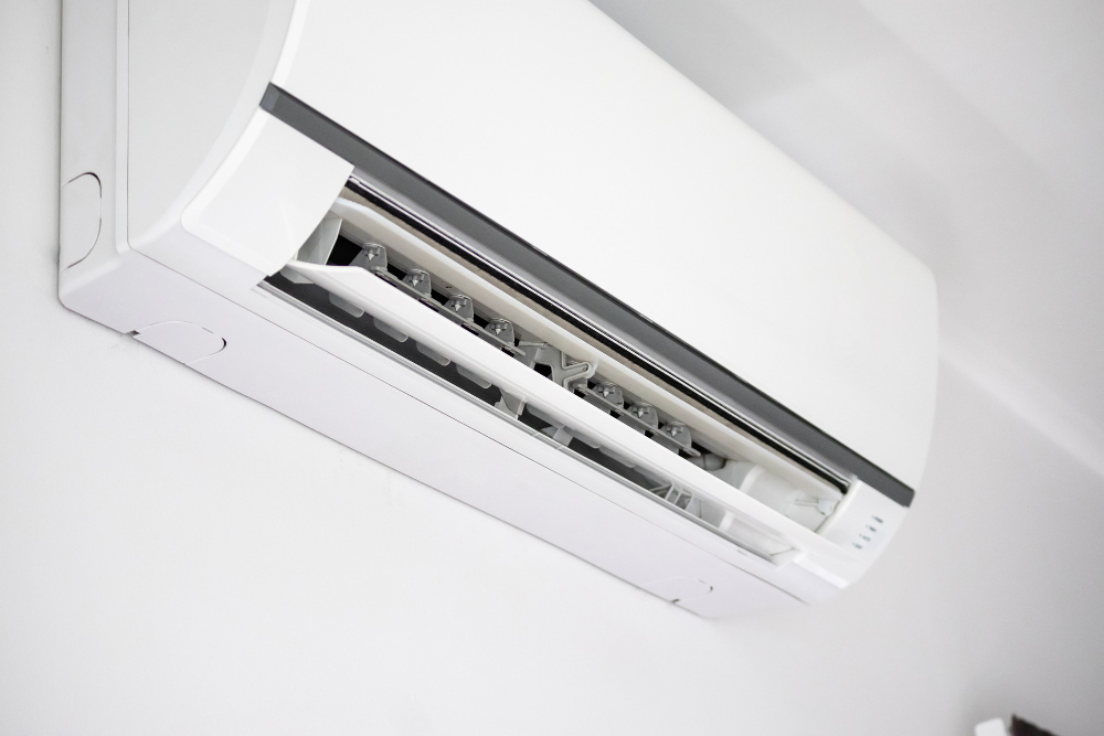 Mini-split air conditioning unit mounted on an interior wall