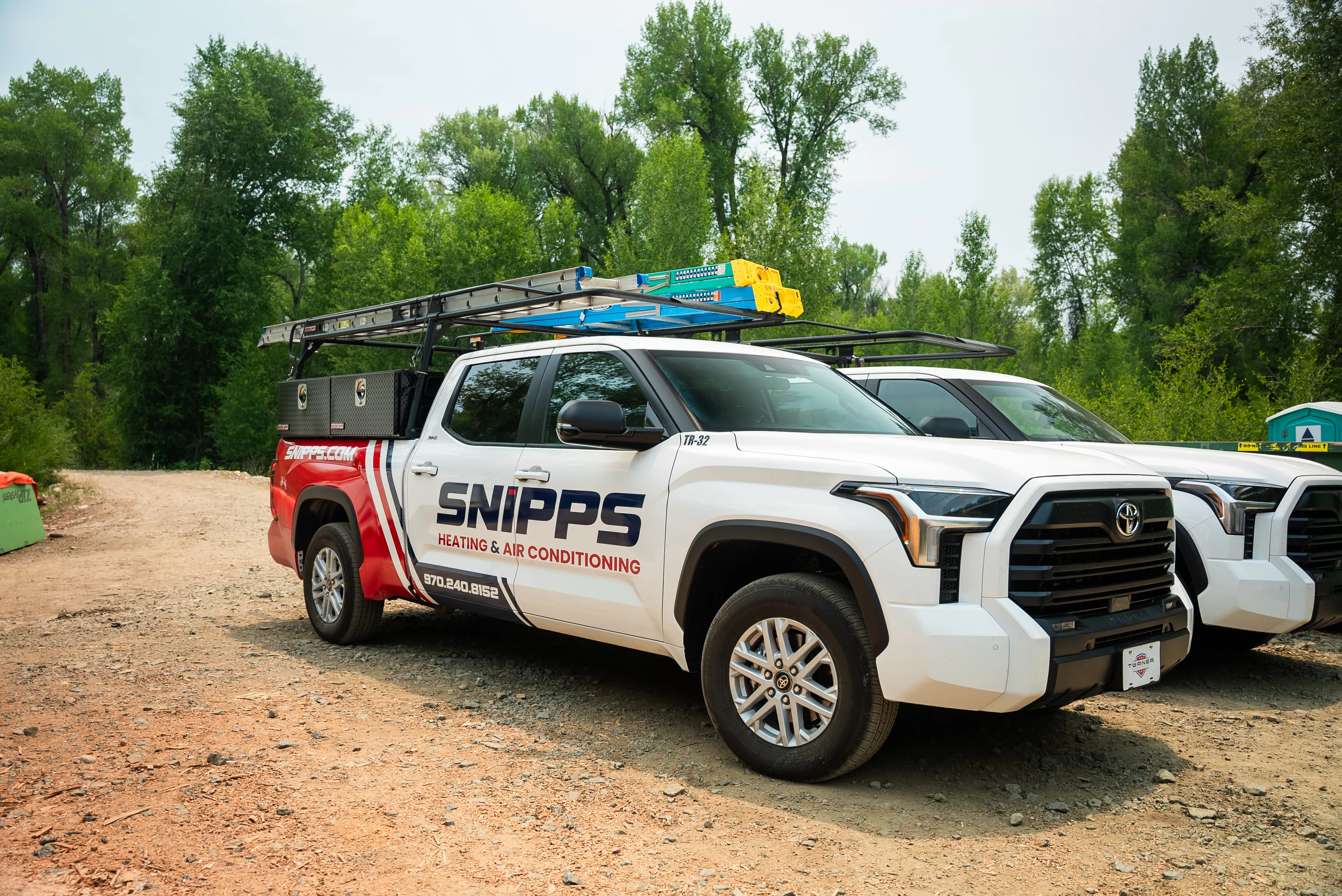 Snipps Heating & Air Conditioning technician servicing HVAC equipment
