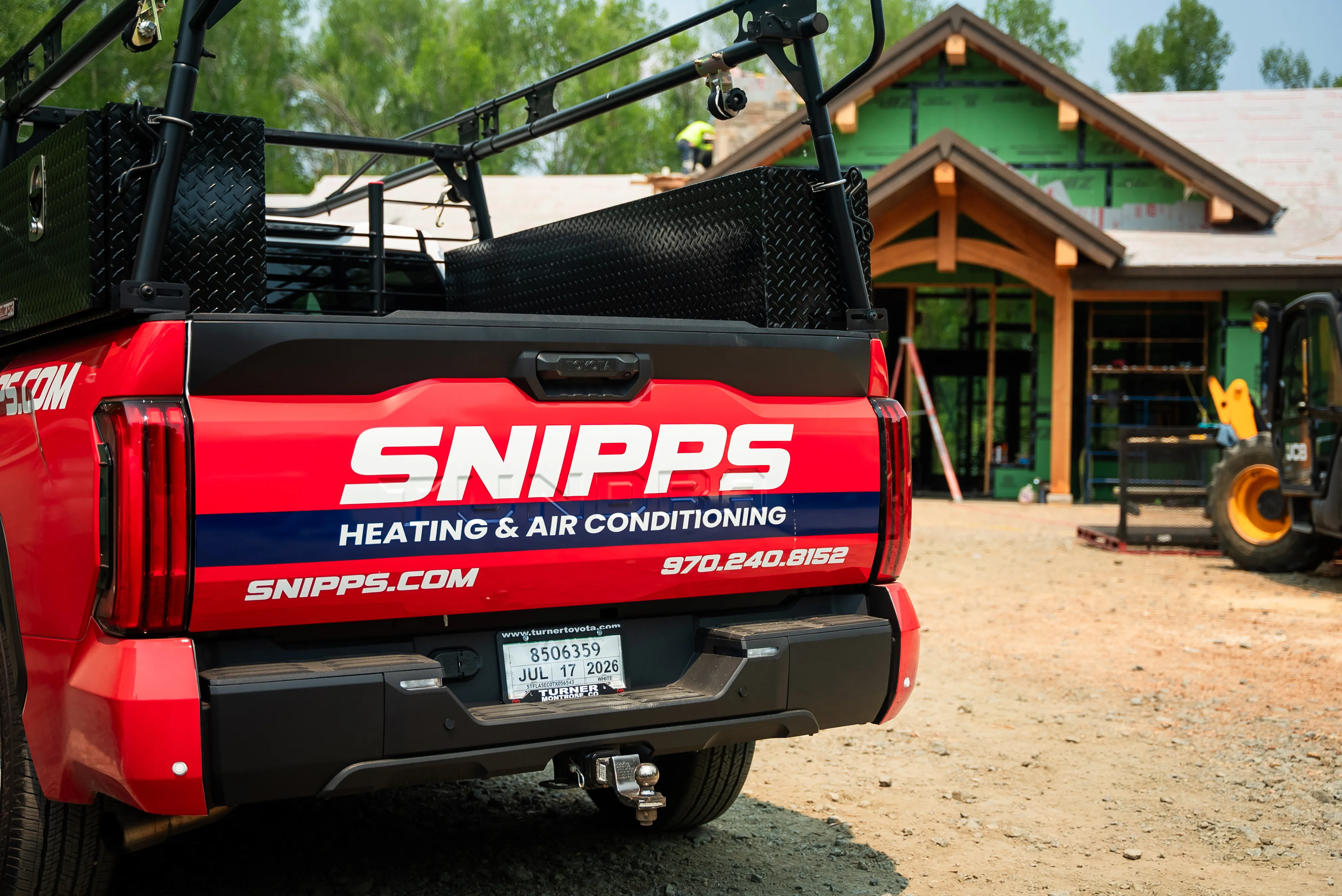 HVAC technician performing maintenance on residential equipment in Montrose, CO