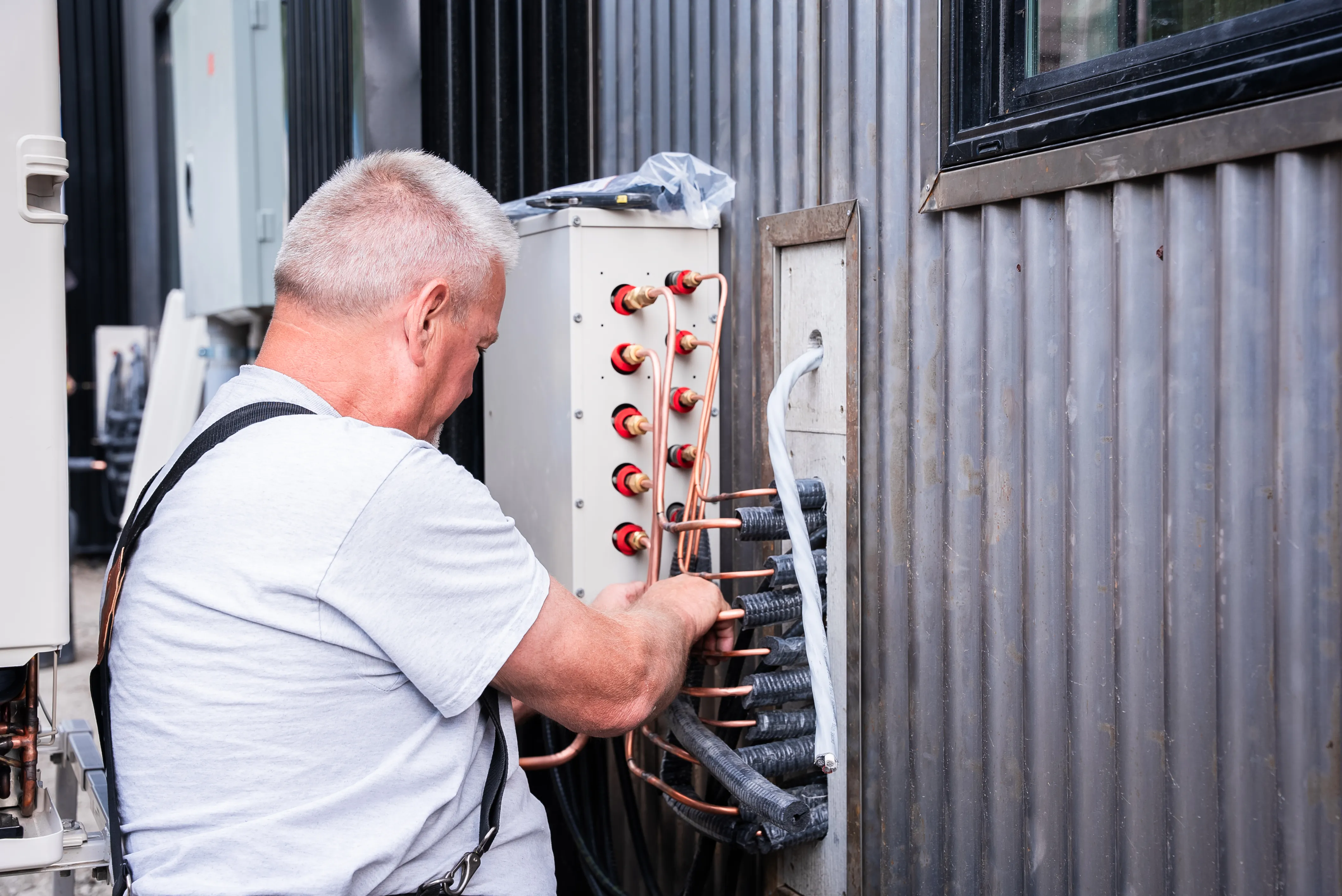 Snipps Heating & Air Conditioning service technician on a job site