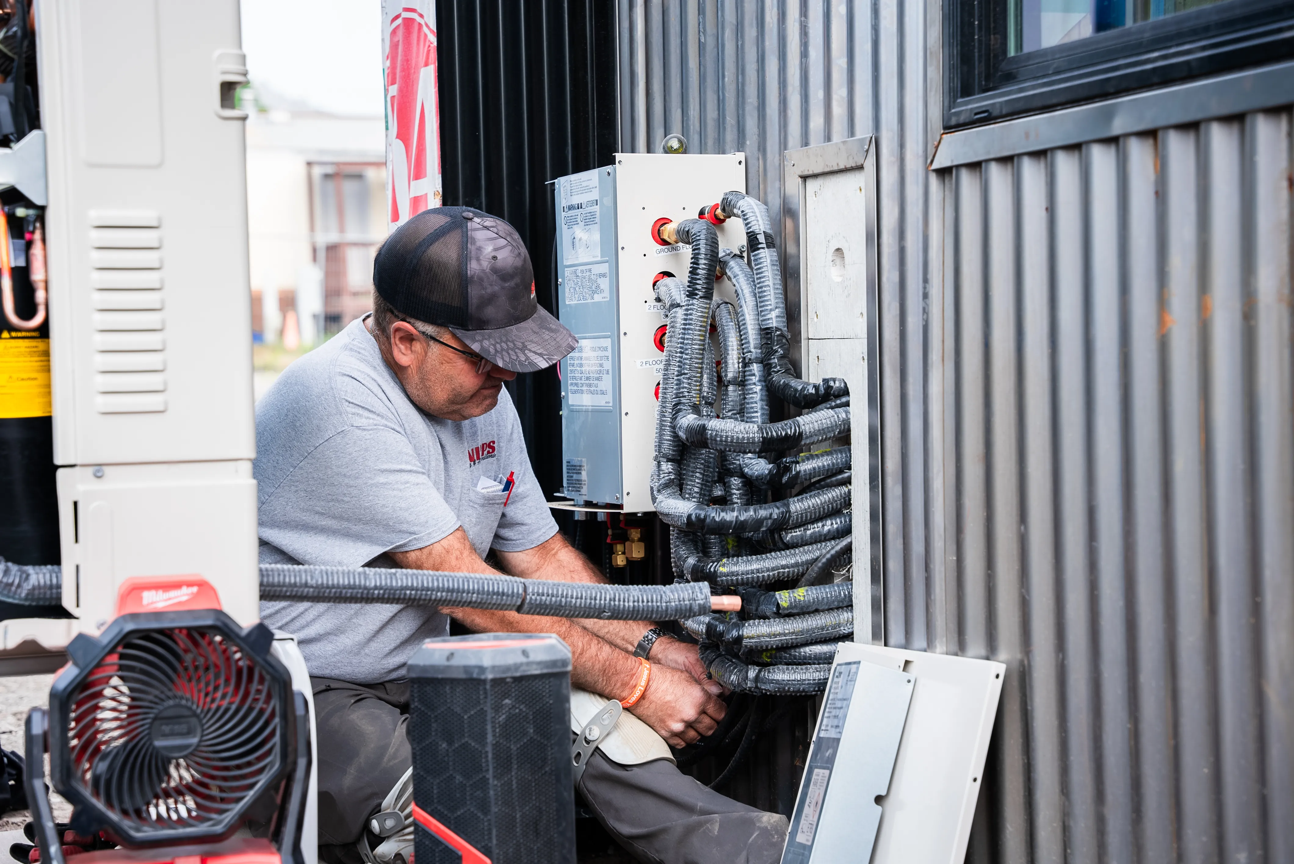 Snipps Heating & Air Conditioning crew member at a service call