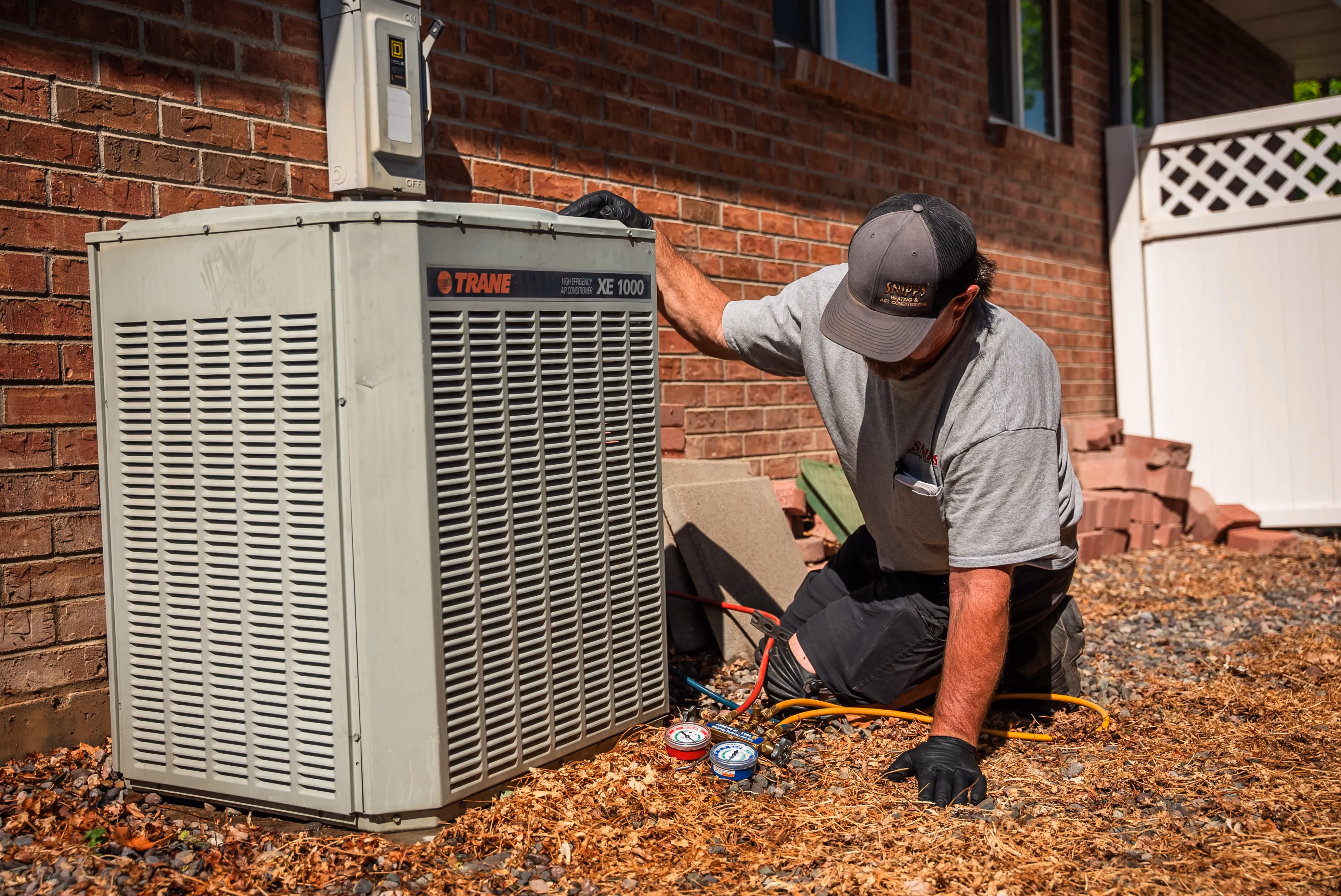 HVAC technician performing maintenance on residential equipment in Montrose, CO