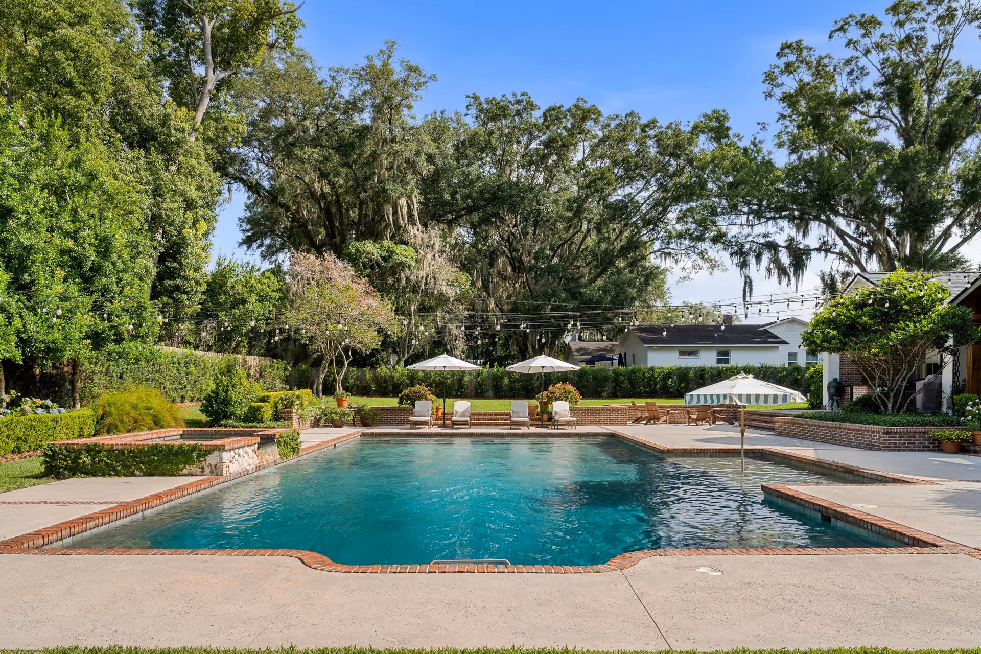 Splashworks technician cleaning a residential swimming pool in Ocala, Florida