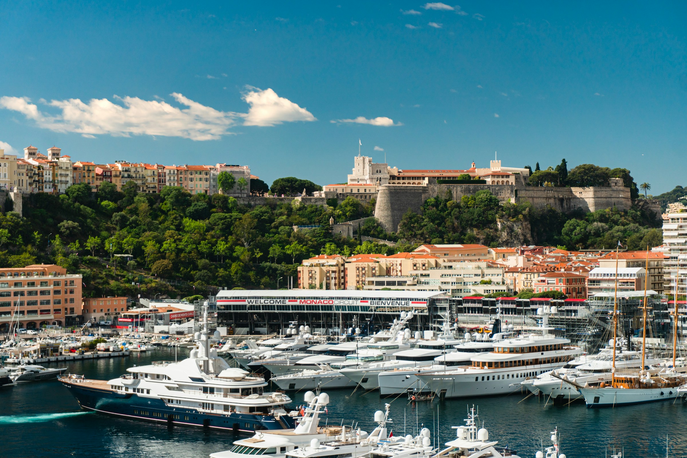 Port Hercule, Monaco, packed with white yachts on calm reflective water