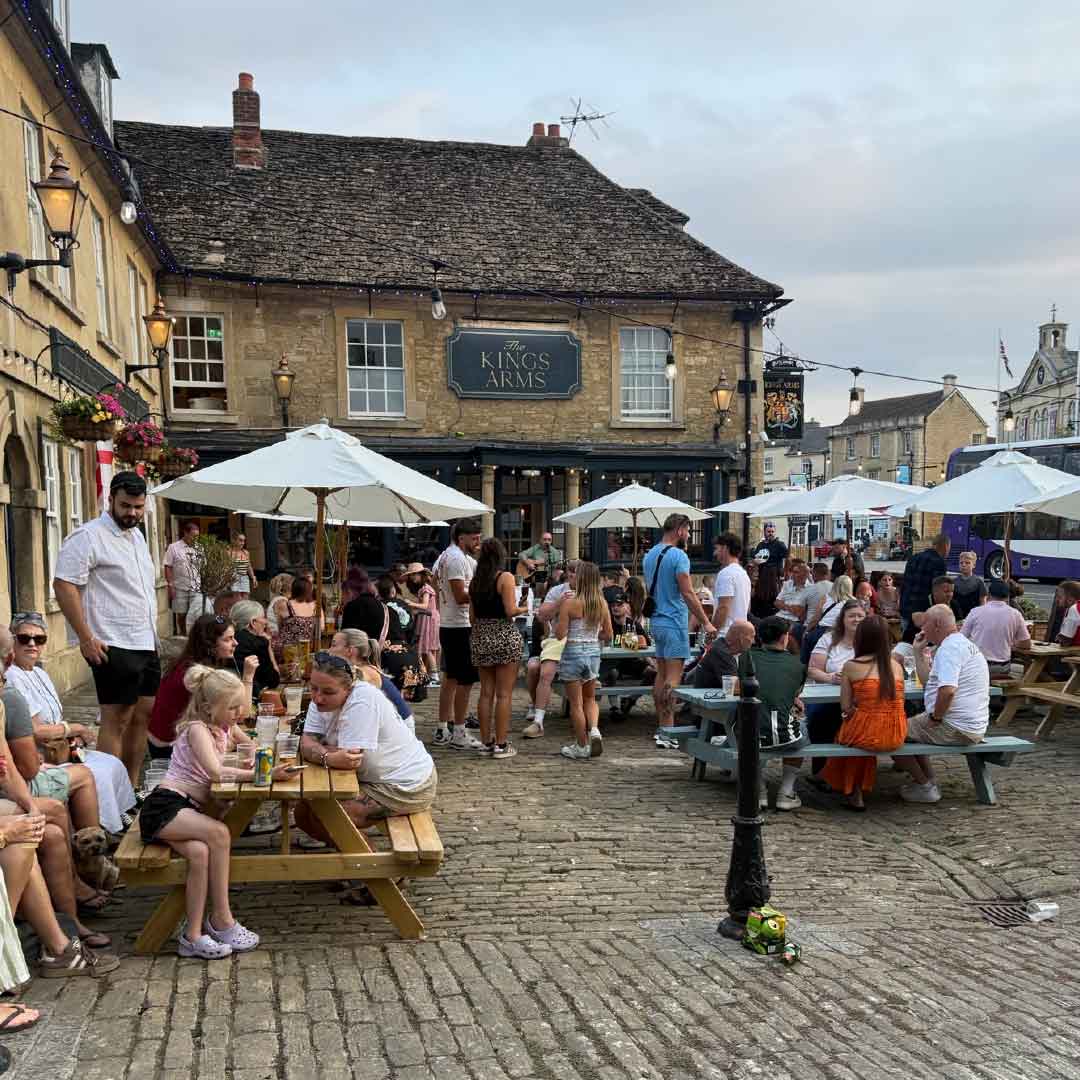 Image showing people stood outside The King's Arms enjoying entertainment.