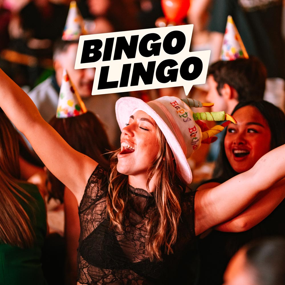 Two young women are the focus in a partying crowd