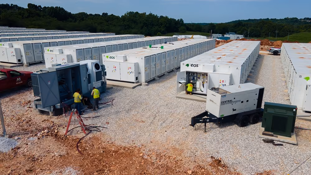 Aerial view of a modular building construction site surrounded by trees