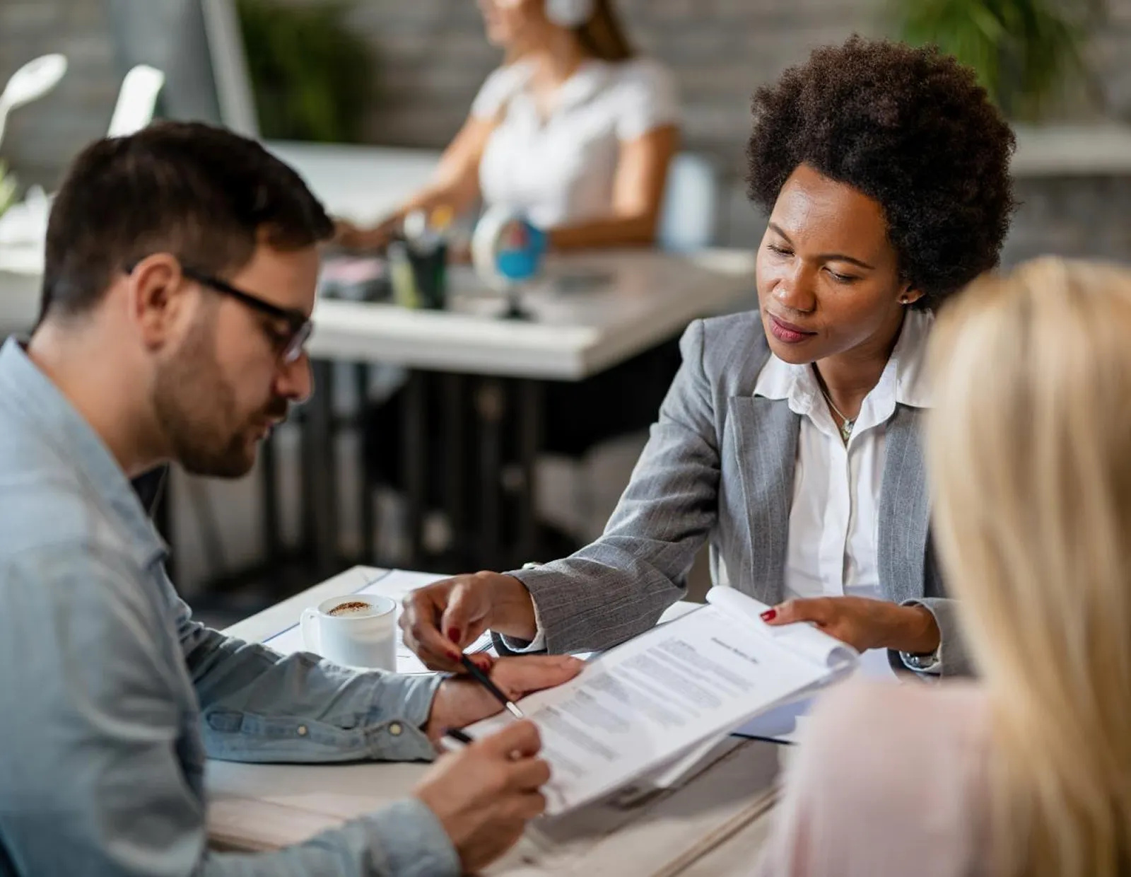 Insurance advisor comparing coverage options across multiple carriers with clients