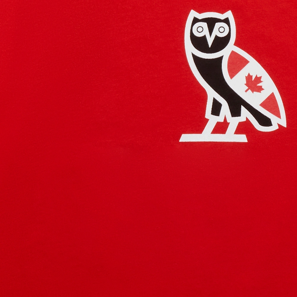Octobers Very Own logo close up on a red fabric