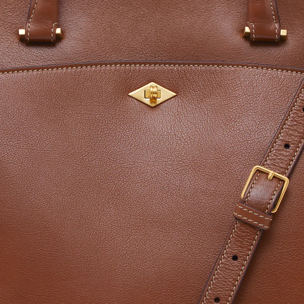 Close up photography of brown leather Metier London bag