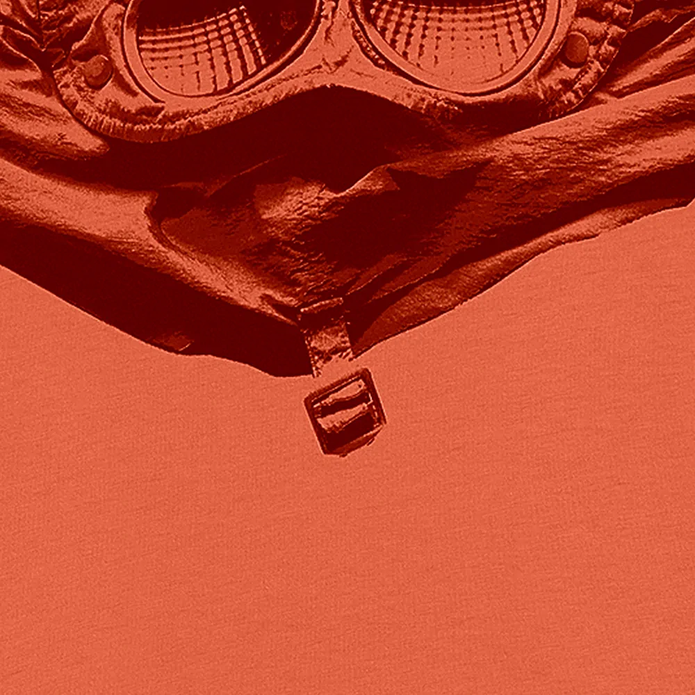 Close up of vibrant orange and red sweater from C.P. Company - eCommerce photography