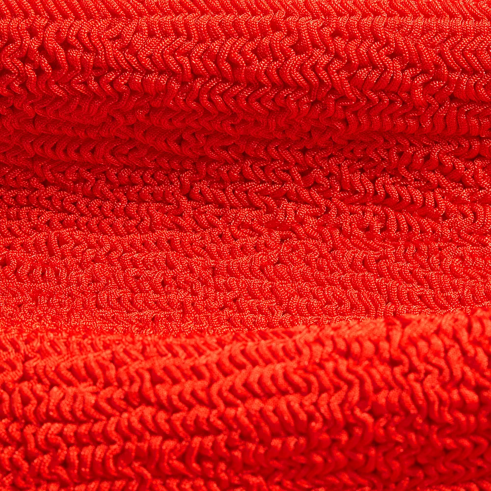 Close up of soft red fabric of a Hunga G London product - product photography