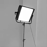 Bright square light mounted on a adjustable stand in a neutral setting.
