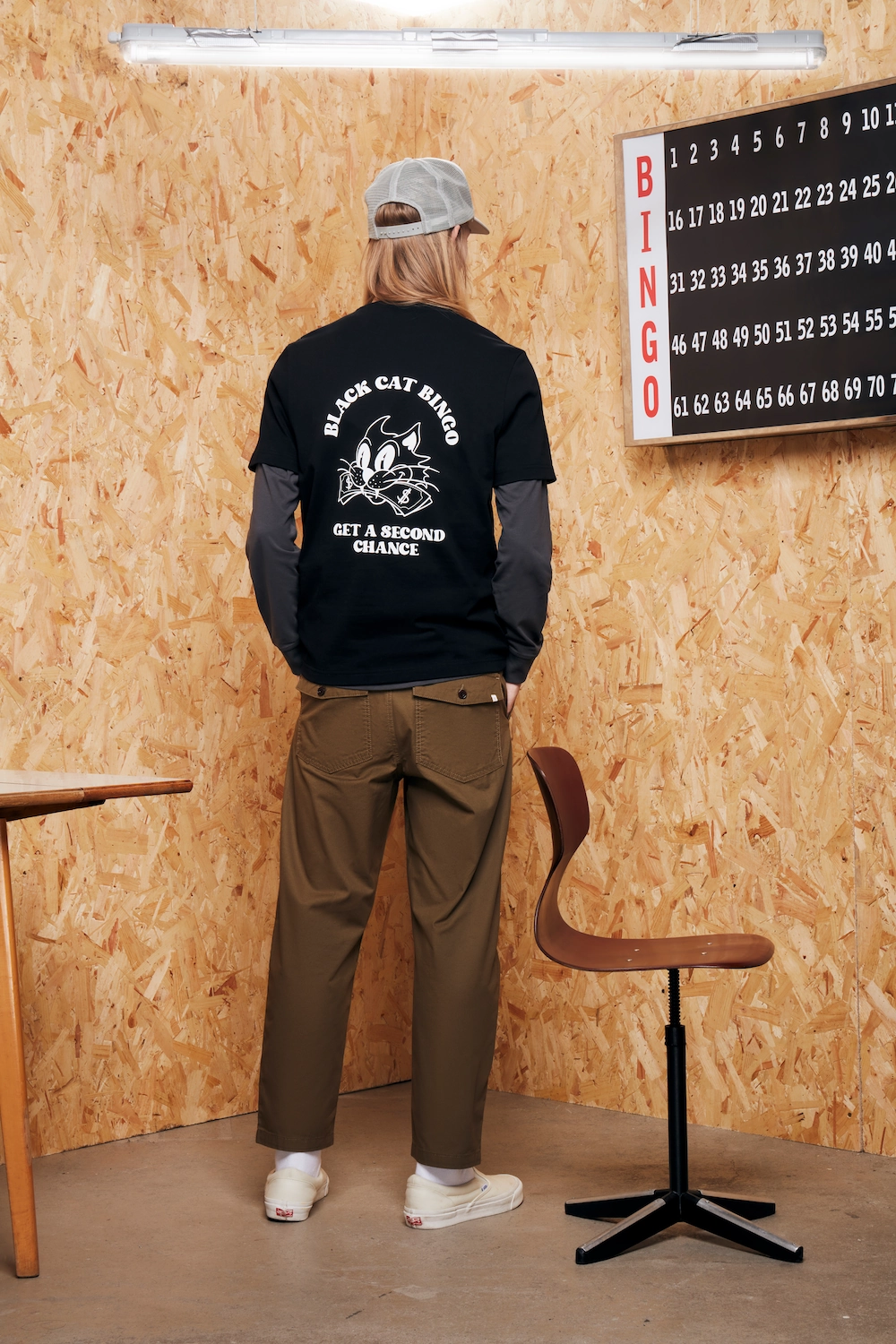 Male model facing the wall with MDF posting for a fashion brand called Farah Menswear, shot at LRP Studios