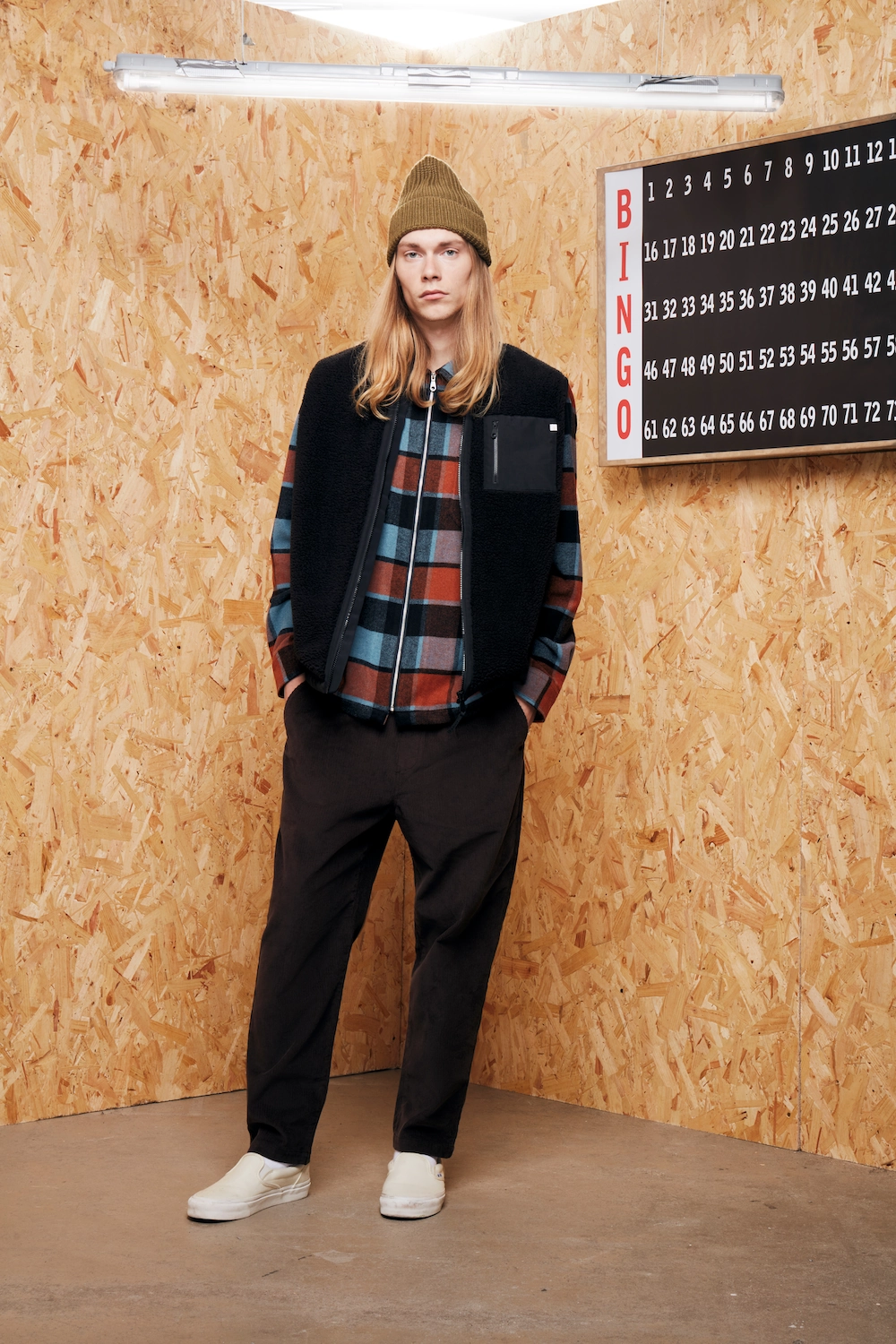 Male model standing surrounded by MDF boards in a creative setting for Farah Menswear eCommerce Shoot at LRP