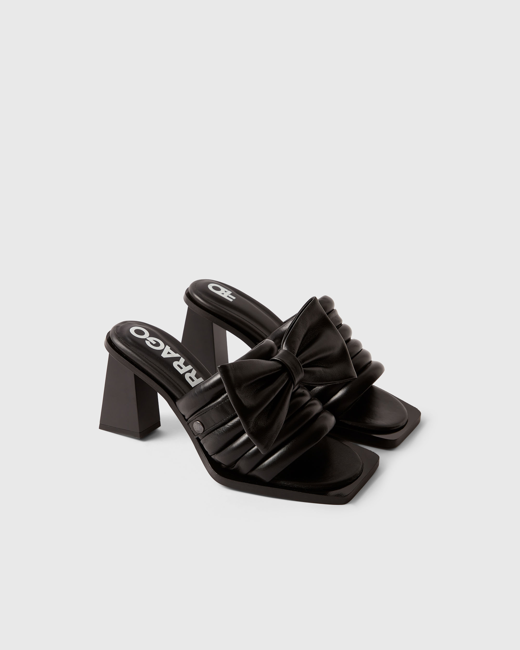 Product photography of a black pair of Farrago mules