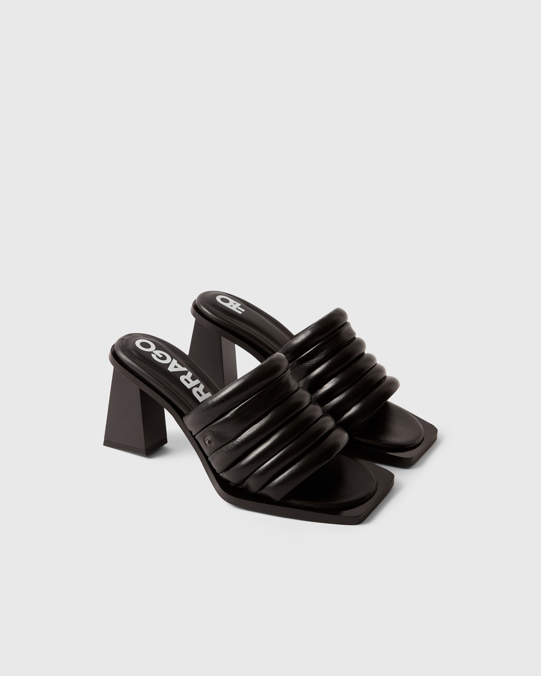 Product photography of a black pair of Farrago mules