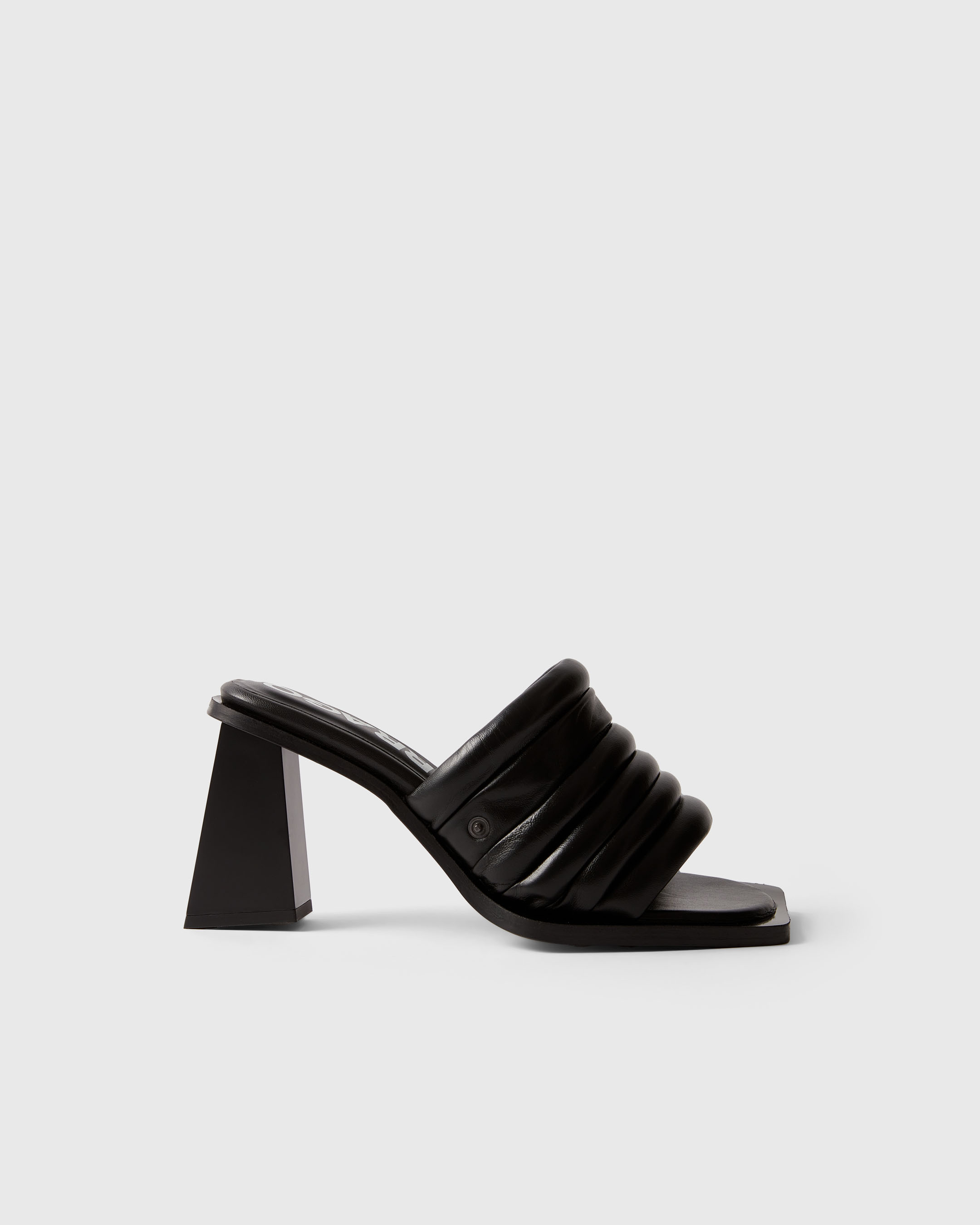 Product photography of a black Farrago mule