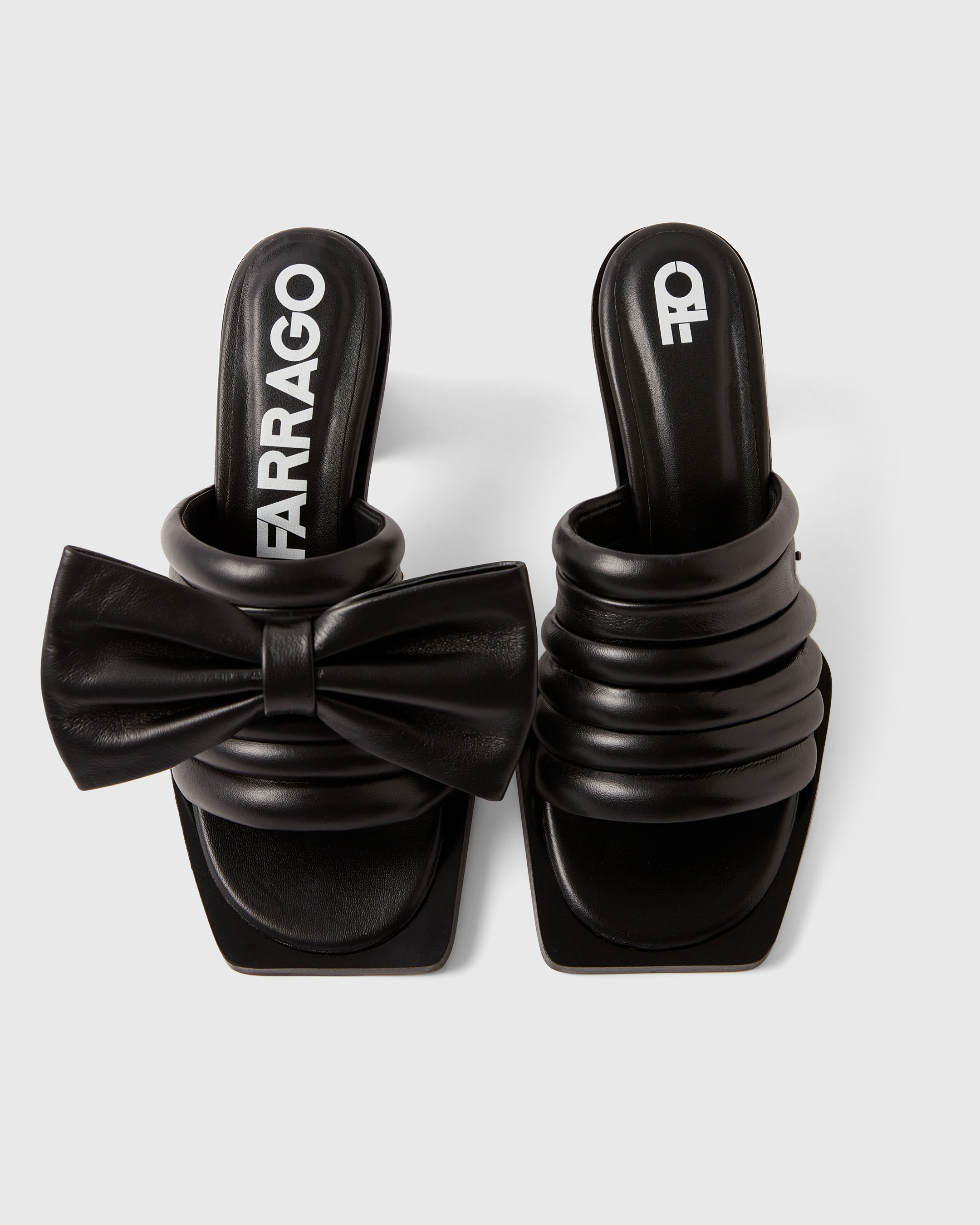 Product photography of a black pair of Farrago mules
