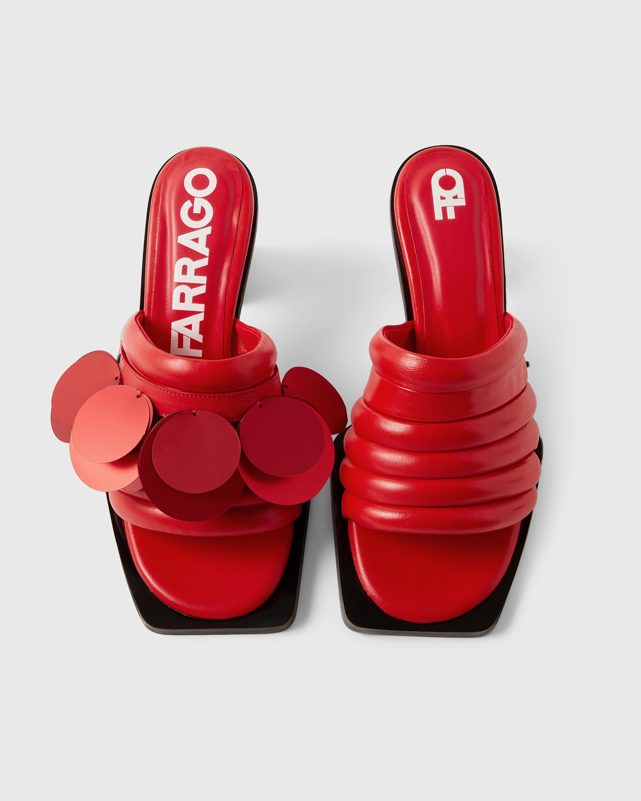 Product photography of a red pair of Farrago mules